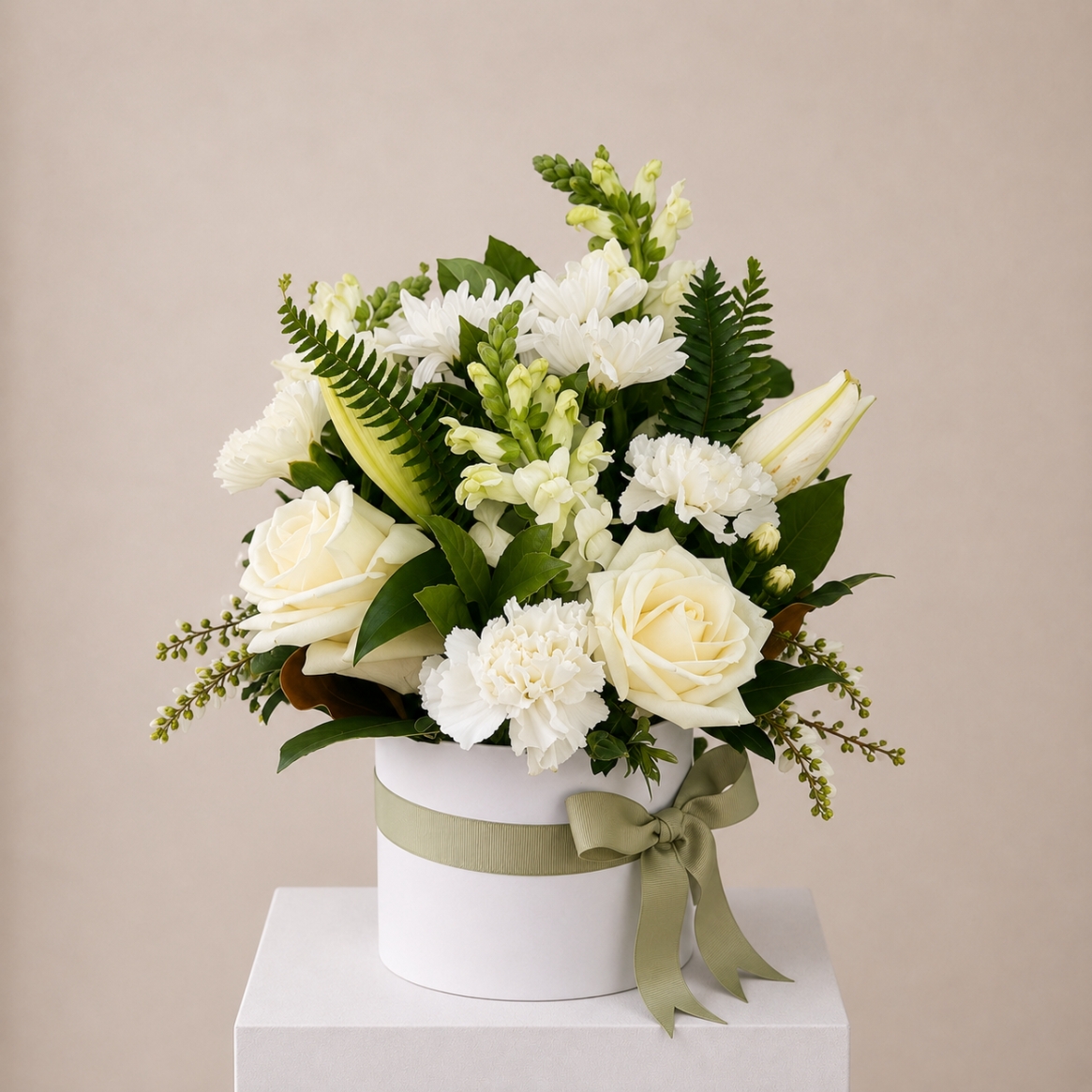 Elegant white sympathy flower arrangement featuring lilies, gerberas and chrysanthemums in a white hat box | Sydney funeral flower delivery