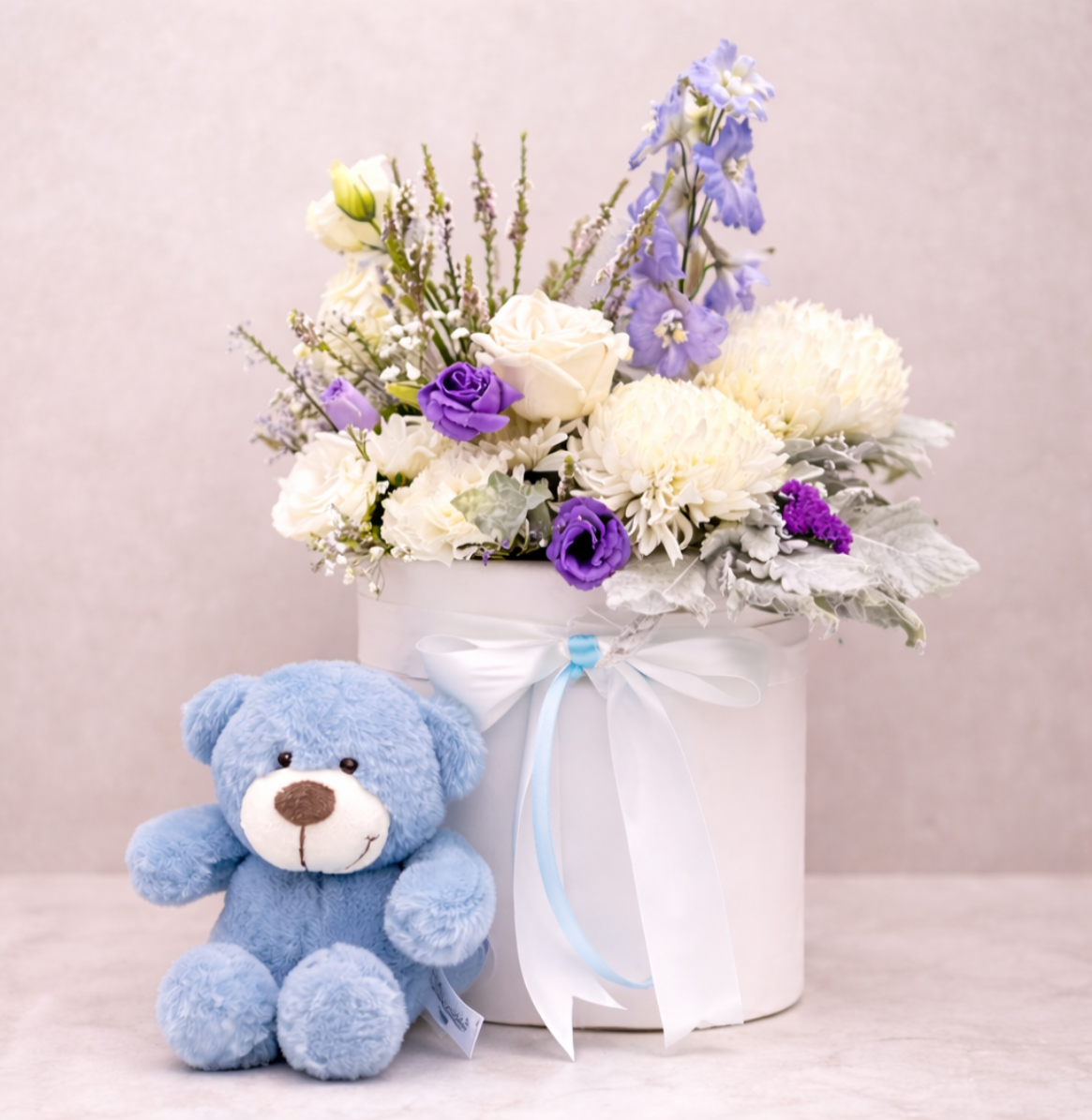 Arrangement of white and purple flowers in a white vase | same Day hospital flower delivery Sydney