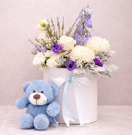 Arrangement of white and purple flowers in a white vase | same Day hospital flower delivery Sydney