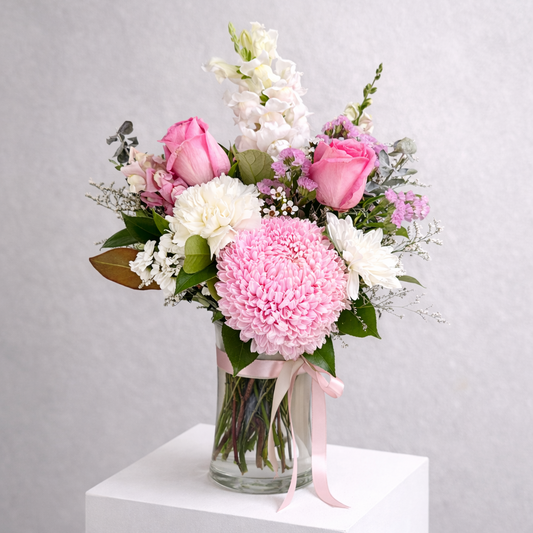 Elegant pink and white flower arrangement with roses, chrysanthemums and snapdragons with luxe green foliage in a glass vase flower delivery Castle Hill Florist