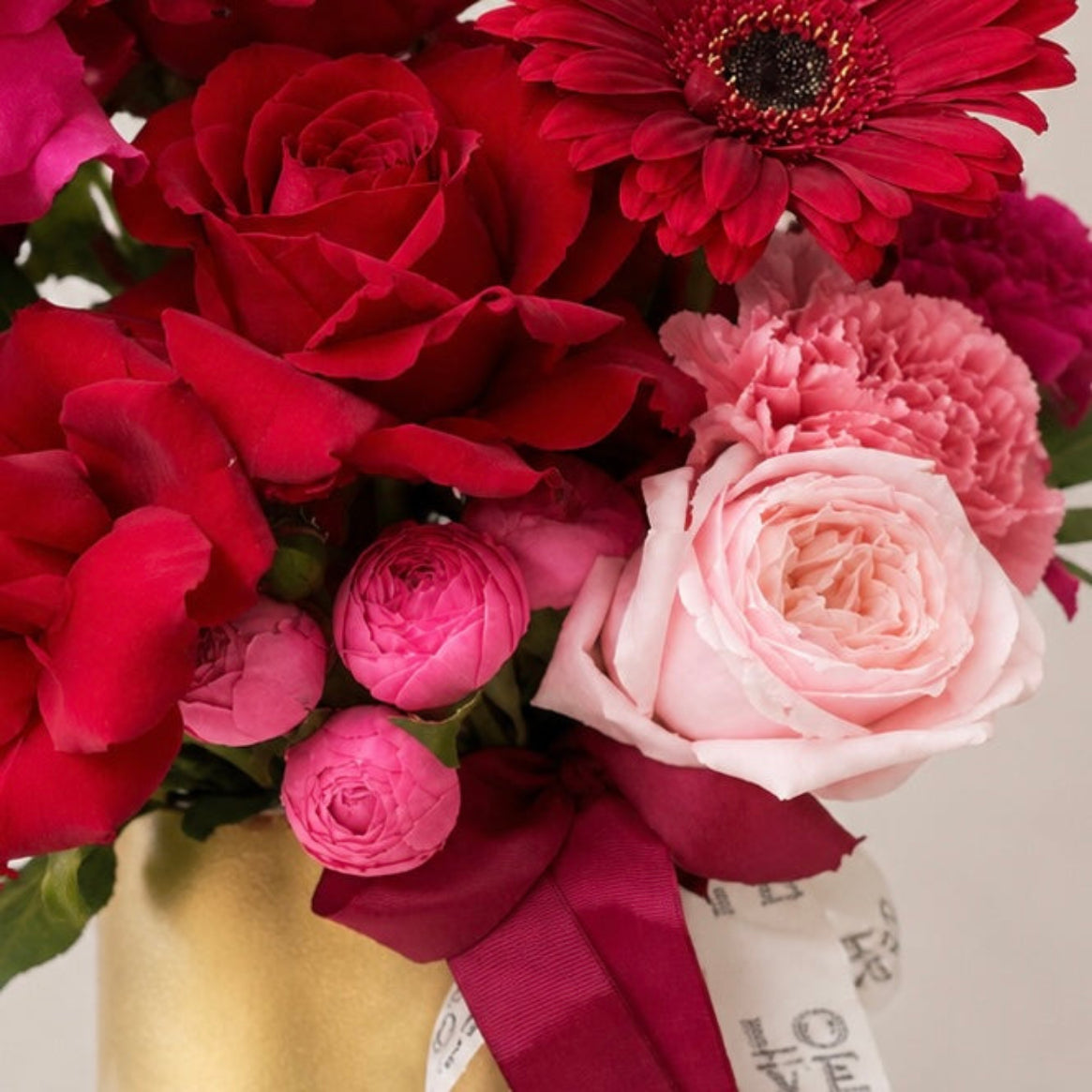 Red and pink roses and flowers with a gold vase - same day flower delivery North Rocks, Epping and Beecroft