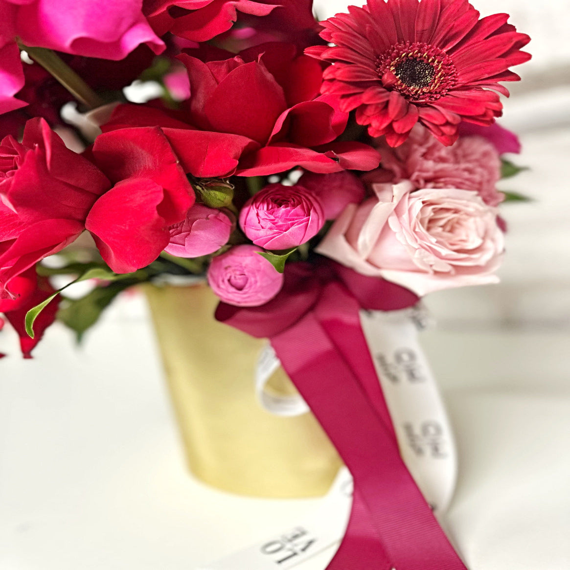 Red and pink roses and flowers with a gold vase - same day flower delivery North Rocks, Epping and Beecroft