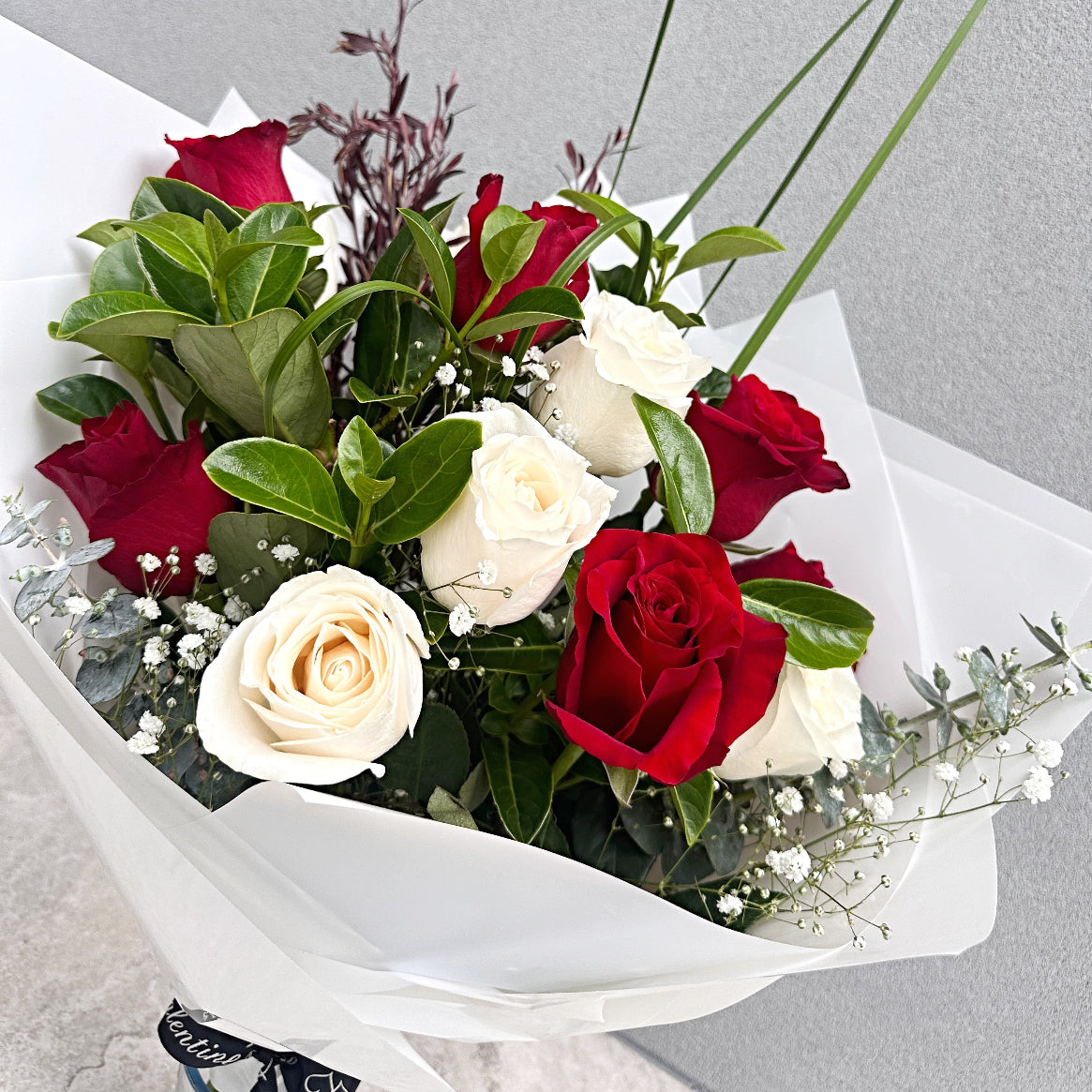 Classic Valentine's Day Red and White Rose Bouquet with greenery and Baby's Breath