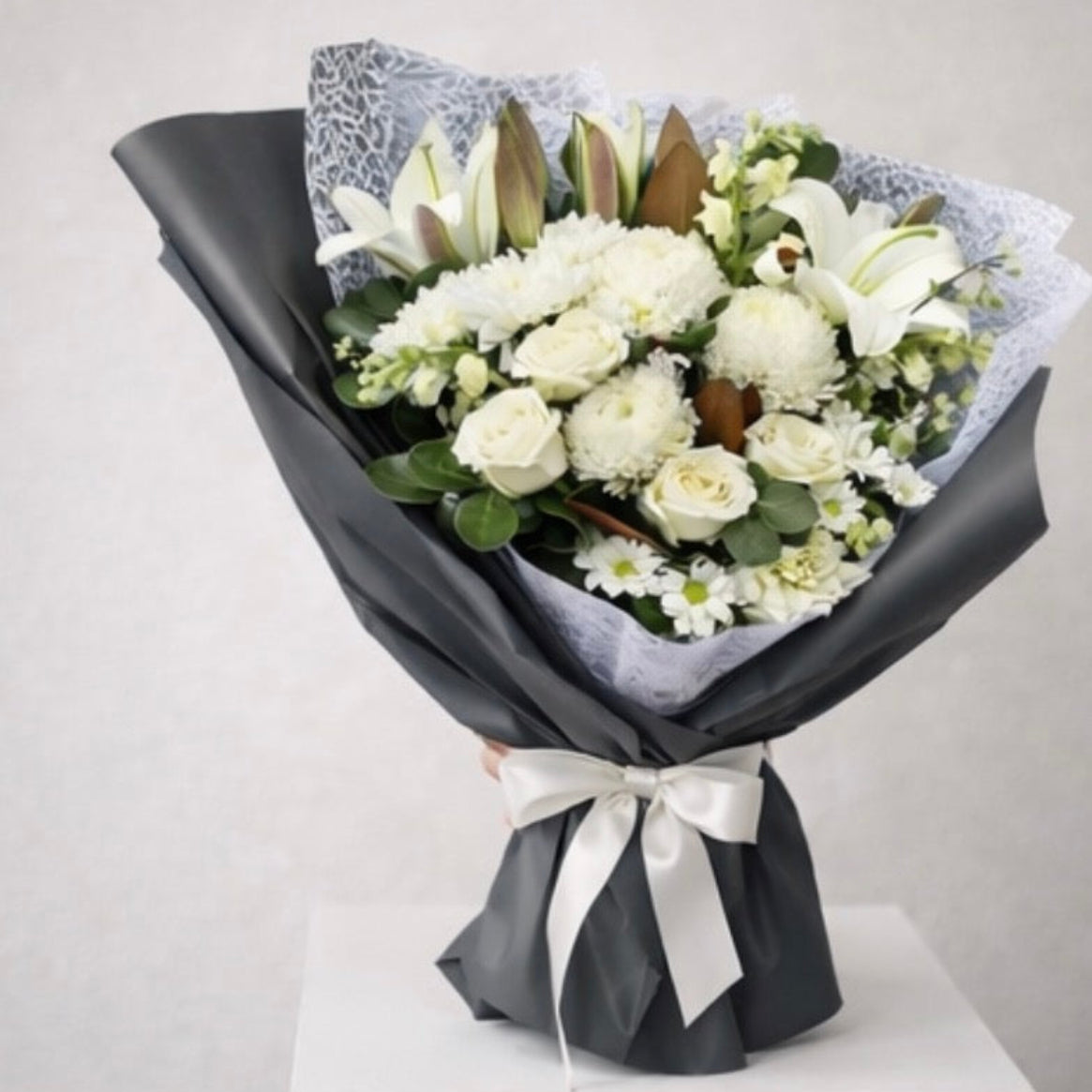 White elegant flowers perfect for sympathy, available for same-day flower delivery Sydney wide 