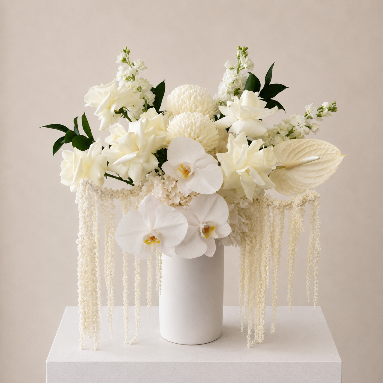Luxury white orchid, reflexed rose and hydrangea arrangement in a modern ceramic vase with cascading white amaranthus by Bella Bloom Bar Sydney.
