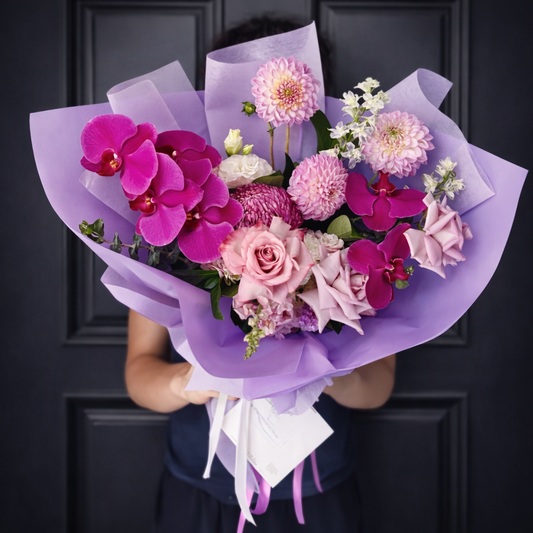 Purple flower bouquet with Phaelaenopsis Orchids and lilac roses, dahlias and chrysanthemums. Flower deliver Castle Hill and Kellyville