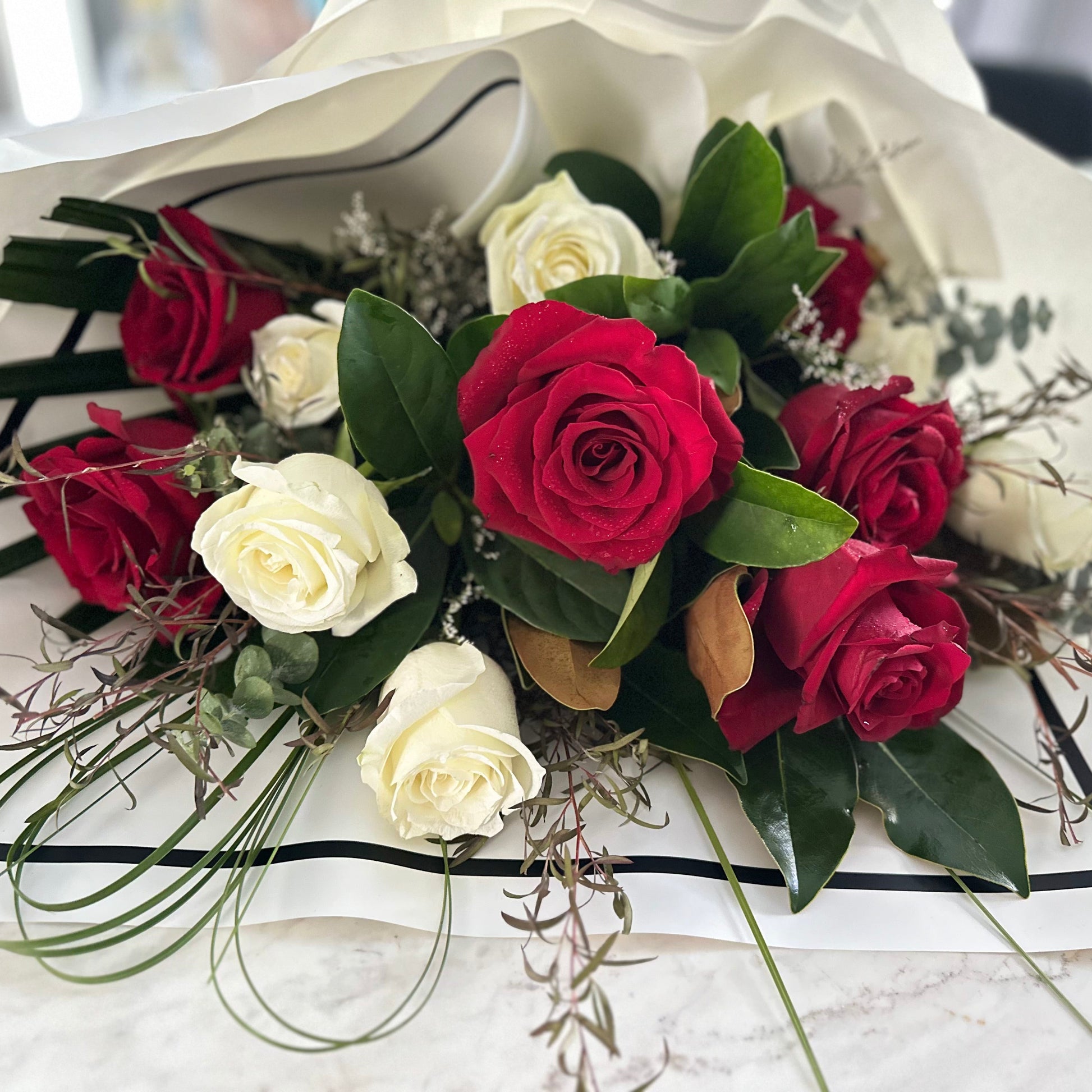 Red and white premium roses bouquet elegantly presented | same day flower delivery West Pennant Hills 