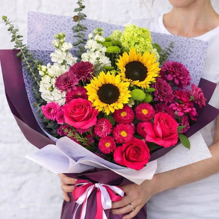 Bright bouquet with sunflowers, roses and seasonal blooms for flower delivery Castle Hill and Hills District