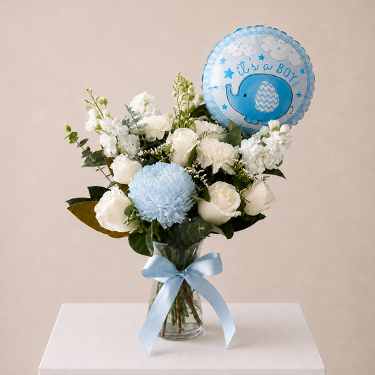Welcome Baby Boy vase arrangement featuring  roses blue flowers and It’s a Boy balloon in a glass vase | same day flower delivery Sydney