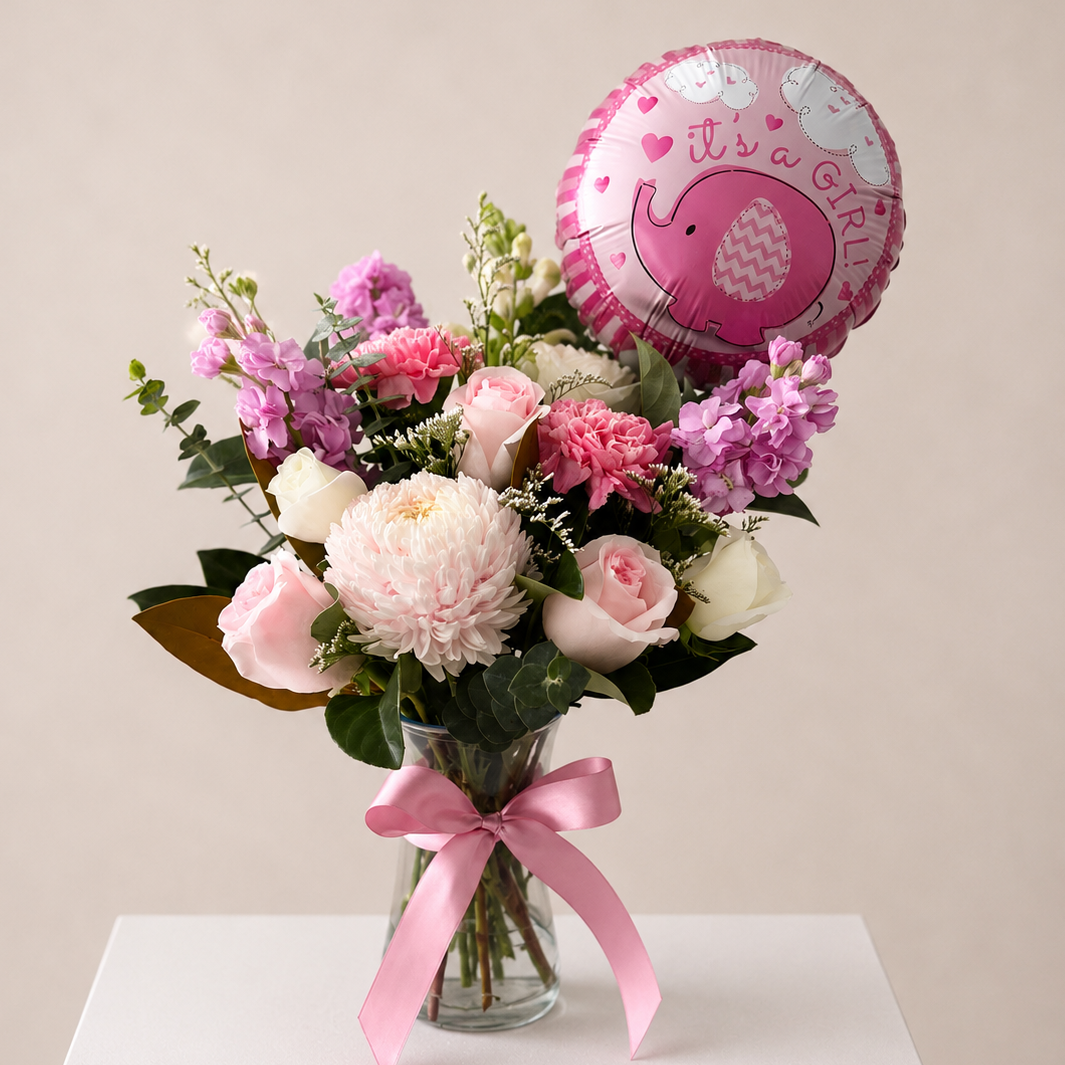 Welcome Baby Girl vase arrangement featuring pink roses and It’s a Girl balloon in a glass vase | same day flower delivery Sydney