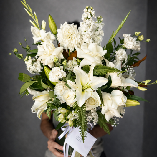 Elegant white Sympathy flower arrangement in vase - same-day flower delivery Castle Hill and Bella Vista