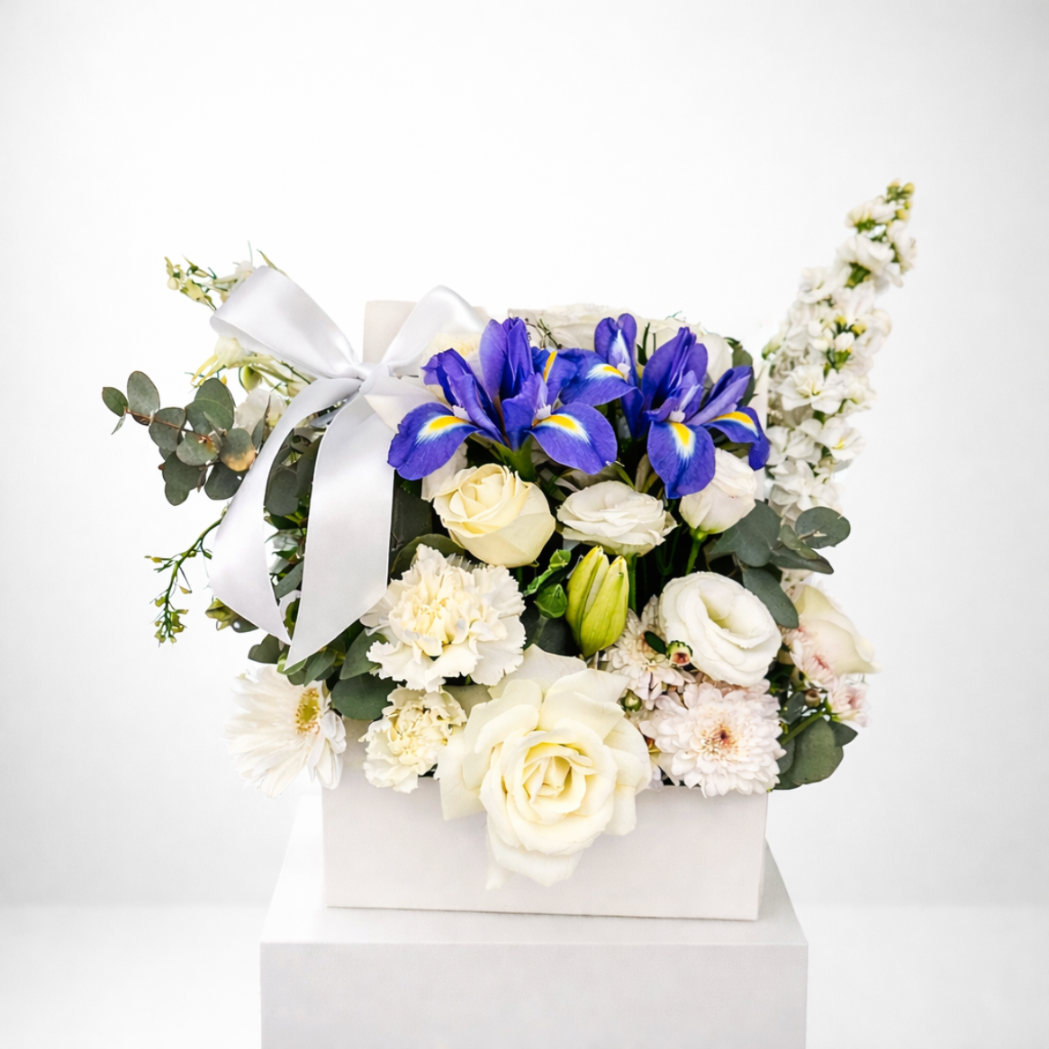 White and blue Sympathy Flower Arrangement available for same-day funeral flowers delivery across Sydney